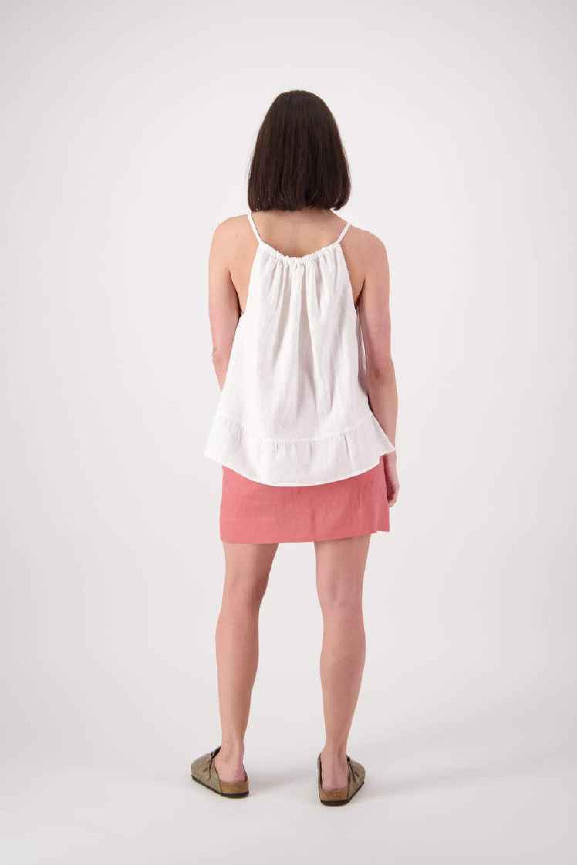 Back view: "Cambrian linen top in white back view showing open halter neck tie, handmade by Lohi Linen in Central Otago"