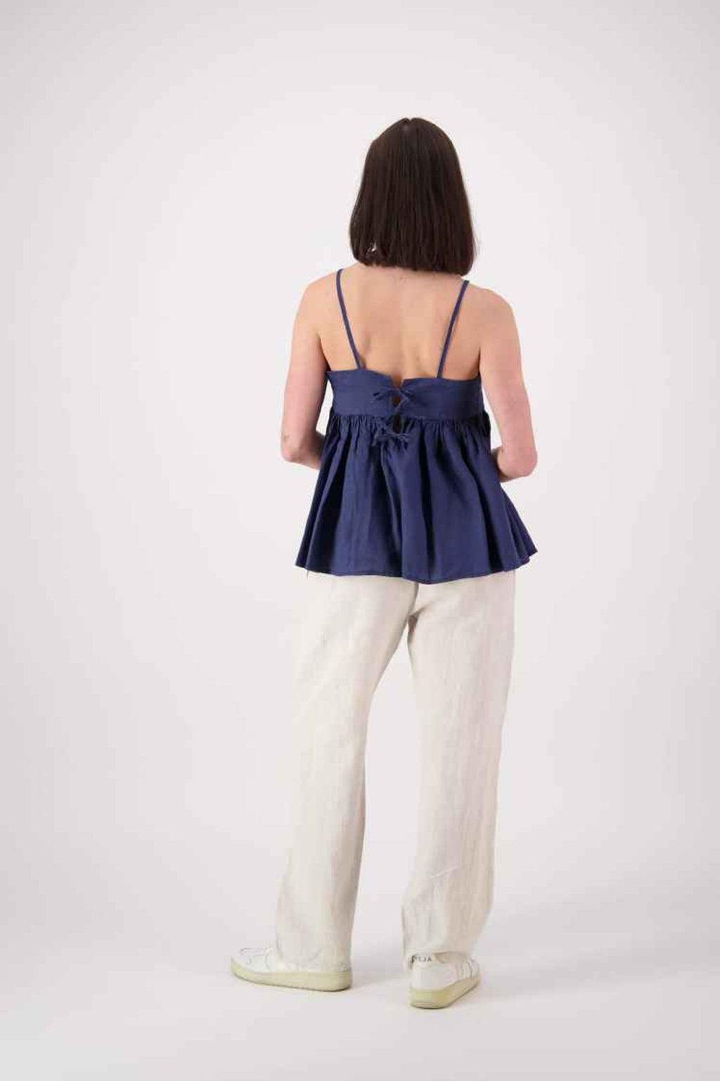 Back view (navy): "Blue Lake linen top in navy back view showing relaxed fit and thin straps, handmade by Lohi Linen in Central Otago"