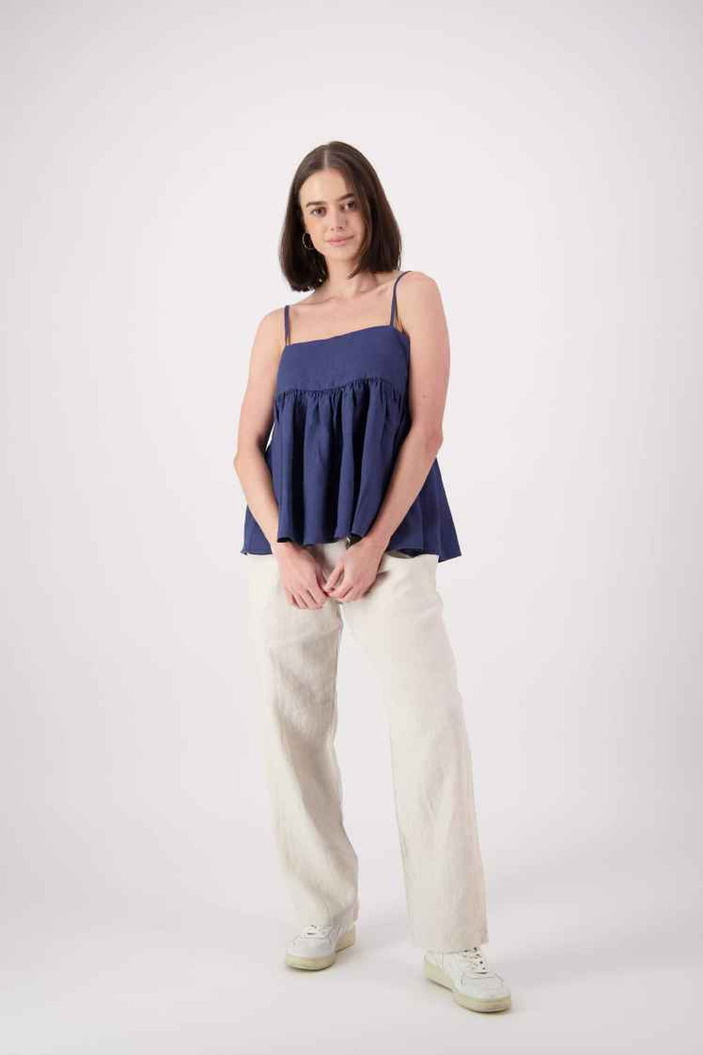 Full length front (navy): "Blue Lake linen top in navy worn with natural linen pants, relaxed pleated cami style, handmade by Lohi Linen in Ranfurly, New Zealand"