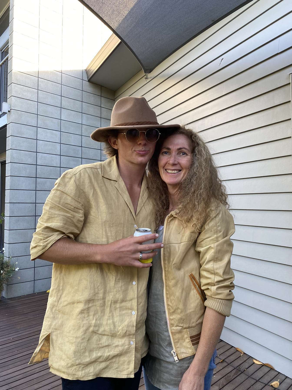 "Patearoa linen shirt worn by a man and woman outdoors, golden natural linen, handmade by Lohi Linen in Central Otago, New Zealand"