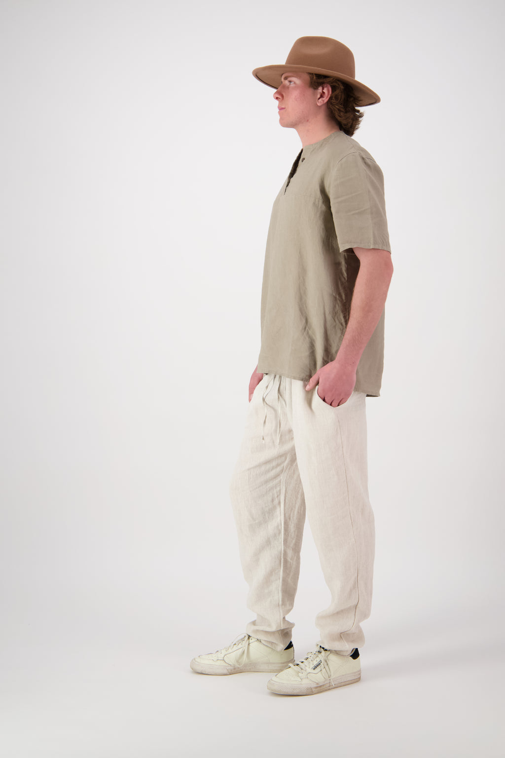 Front view antique pants: "Hawkdun linen top in stone worn with antique pearl linen pants, handmade by Lohi Linen in Ranfurly, New Zealand"