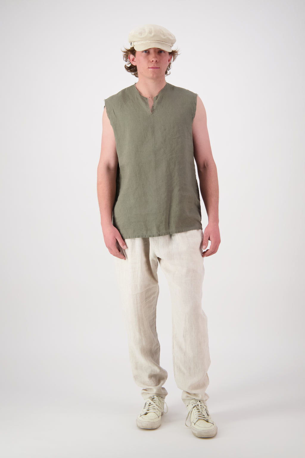 Front view full length: "Rough Ridge linen singlet in olive green full length front view with natural linen pants, handmade by Lohi Linen Central Otago"