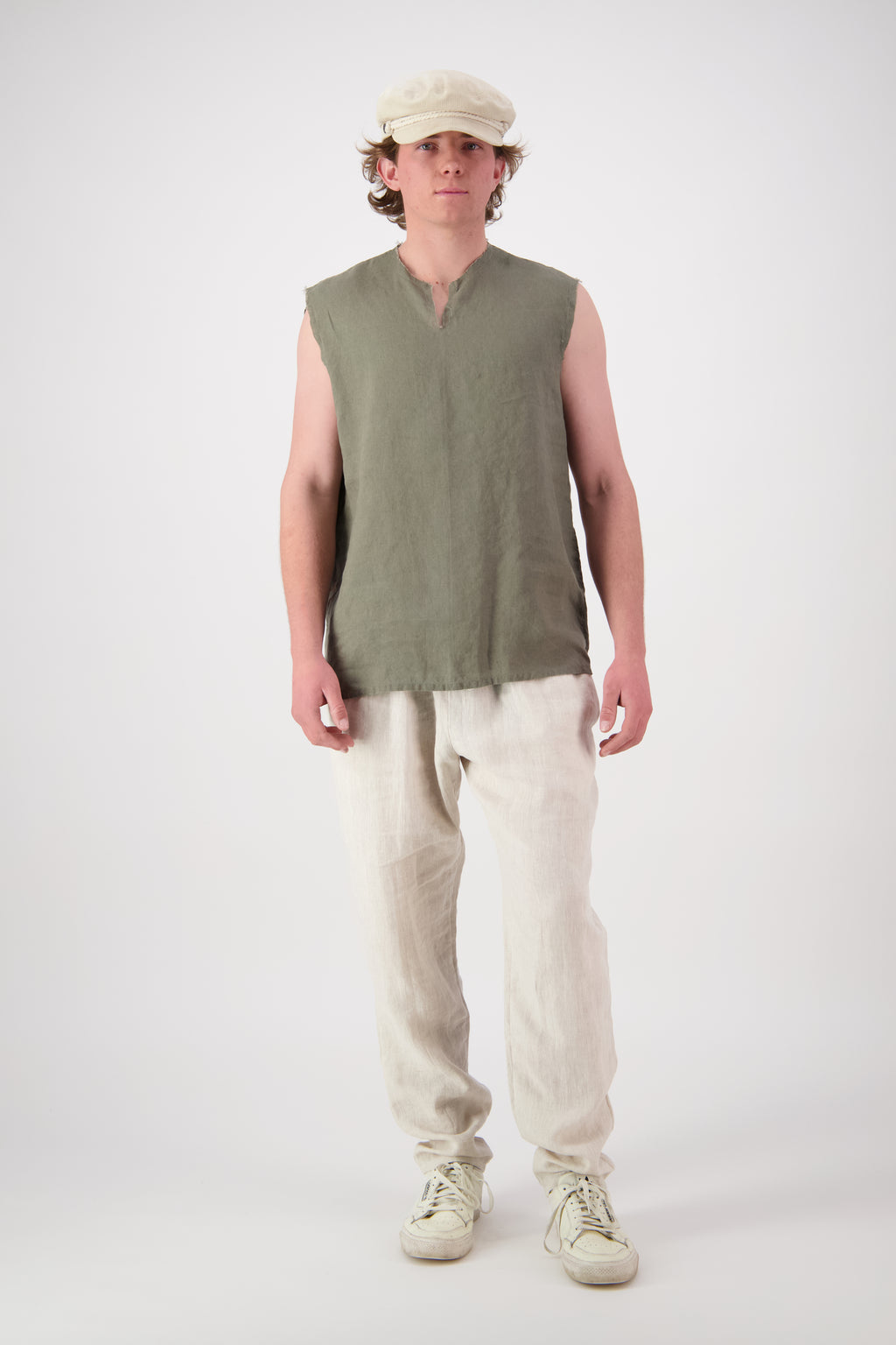 Front view olive singlet: "Mt Buster linen pants mens in Natural front view worn with olive linen top, handmade by Lohi Linen in Central Otago, New Zealand"