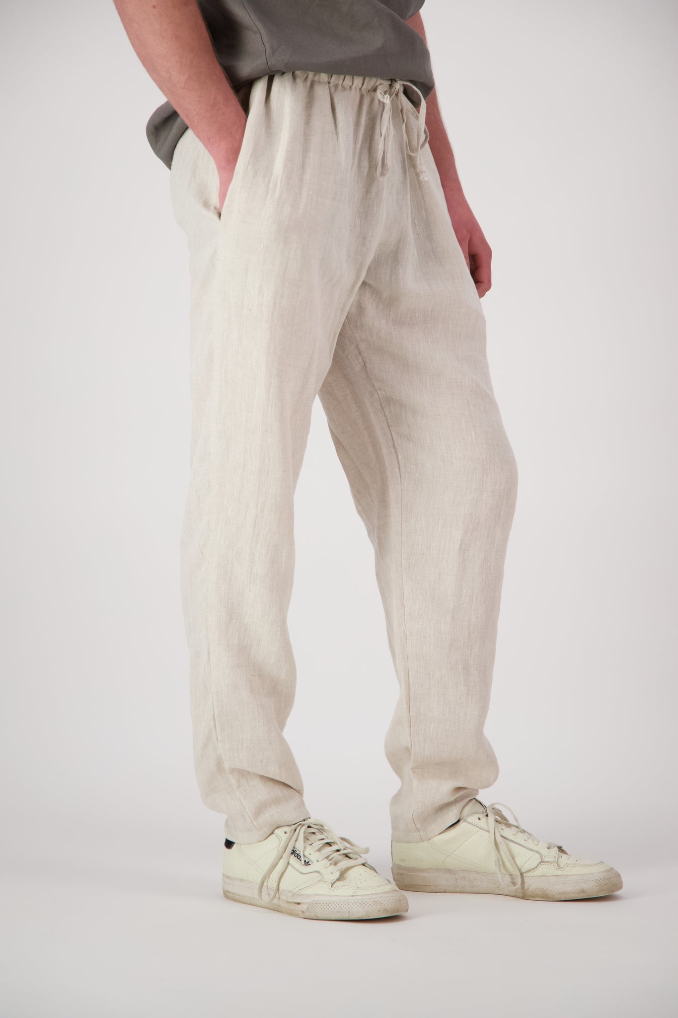 Detail shot legs antique pearl: "Mt Buster linen pants mens in Natural leg detail showing relaxed straight cut and natural linen texture, Lohi Linen Central Otago"