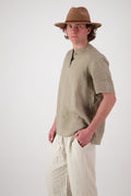 Three quarter view: "Hawkdun linen top in stone three quarter view showing relaxed silhouette, handmade by Lohi Linen Ranfurly"