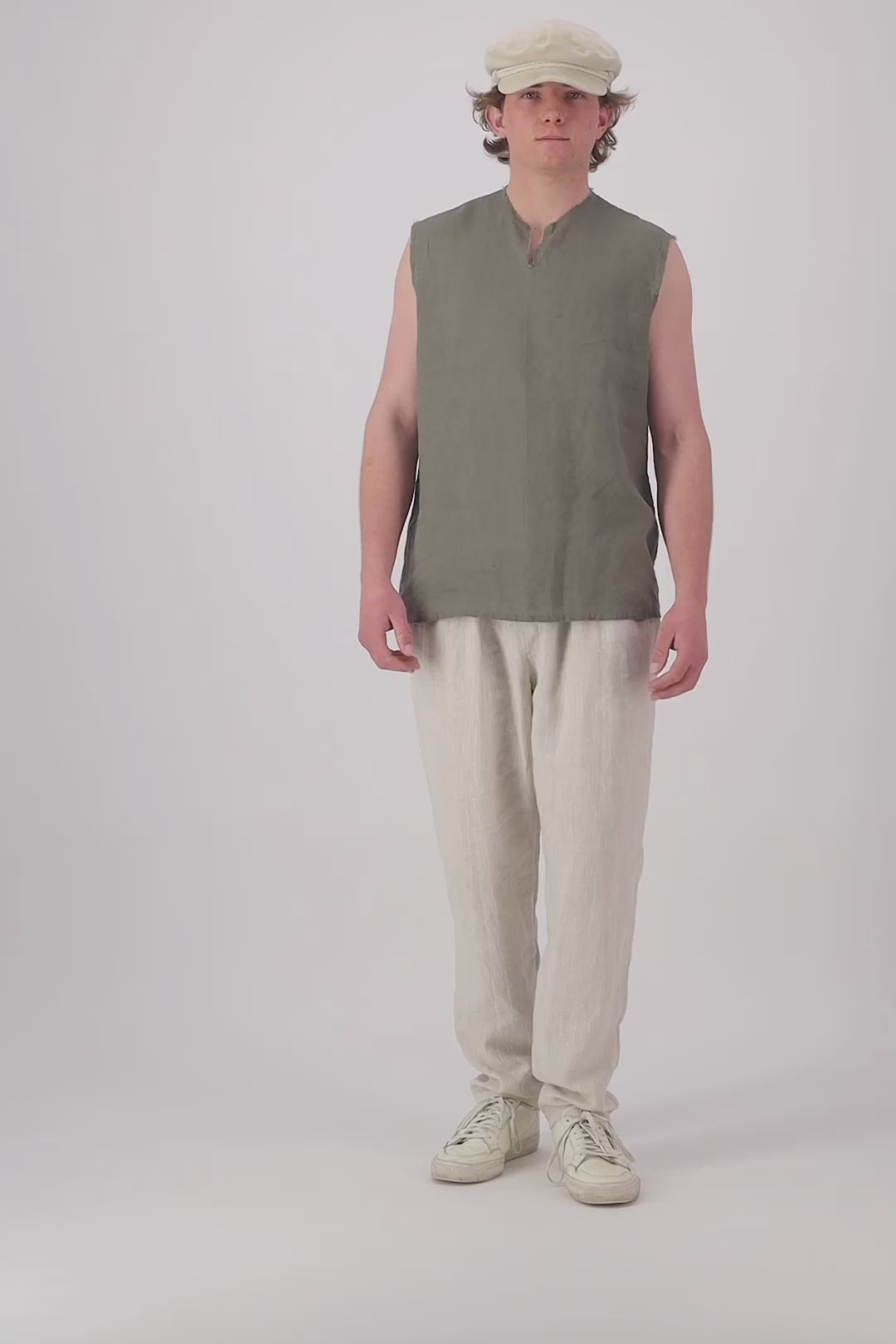 Video thumbnail: "Rough Ridge linen singlet in olive green front view video, relaxed sleeveless V-neck, handmade by Lohi Linen in Ranfurly"