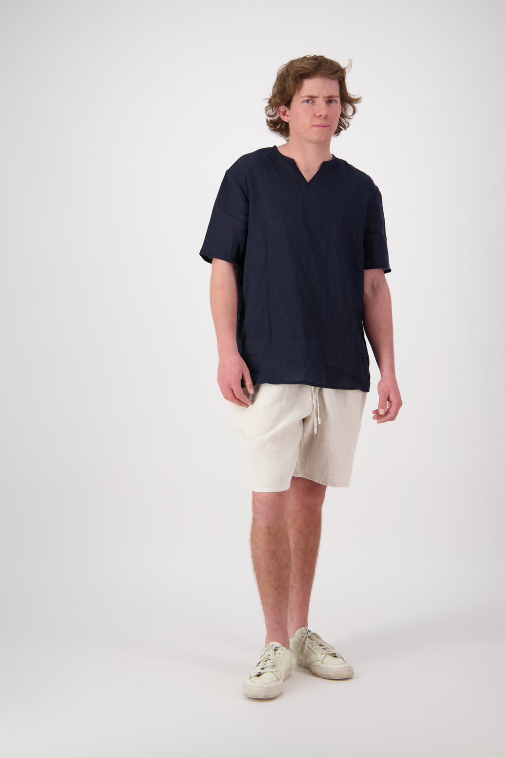 Front view stone: "St Bathans linen t-shirt in Midnight, relaxed short sleeve notch neckline, handmade by Lohi Linen in Central Otago, New Zealand"
